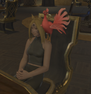 Scarlet Peacock sitting.png